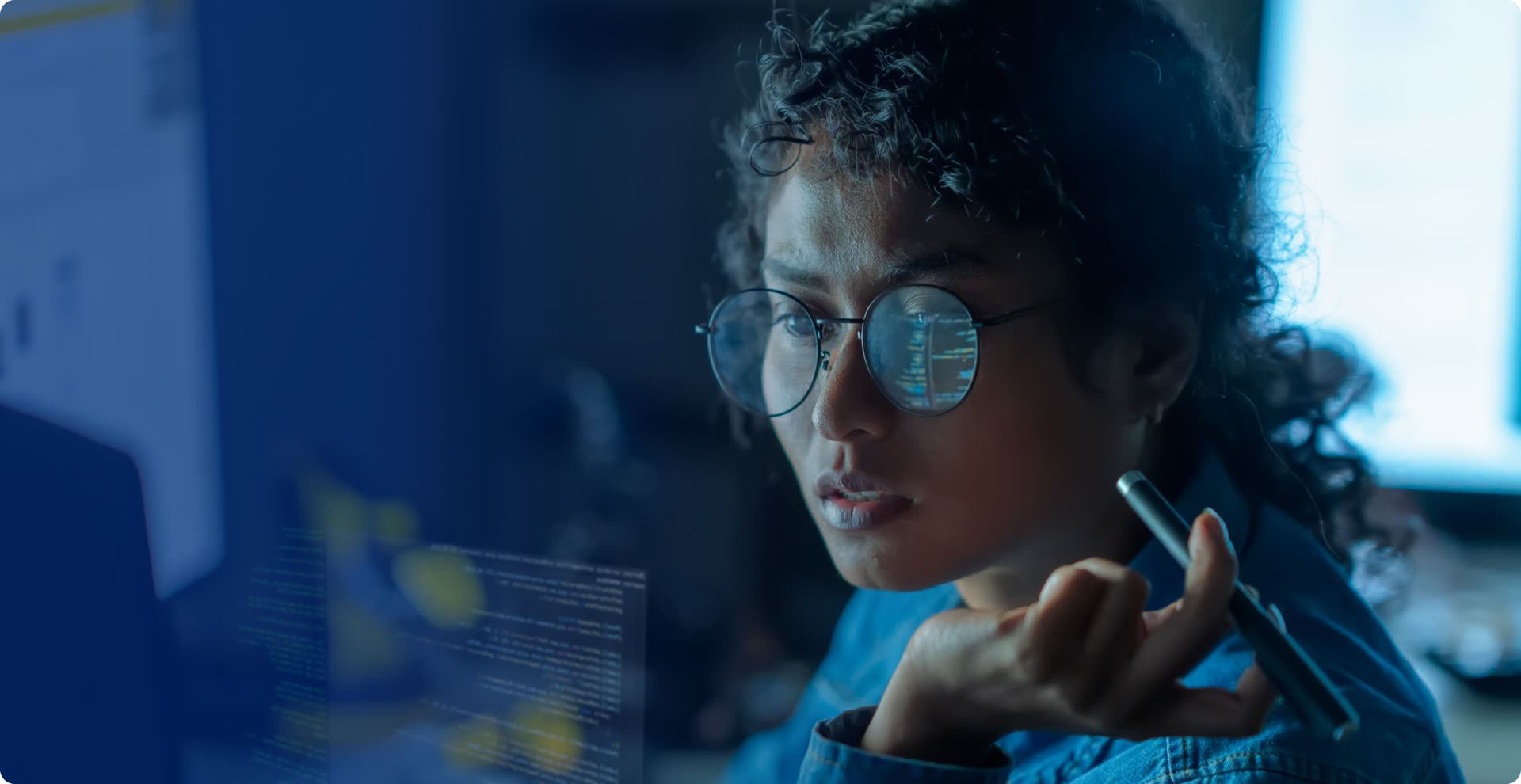 Candidate with code reflected in her glasses