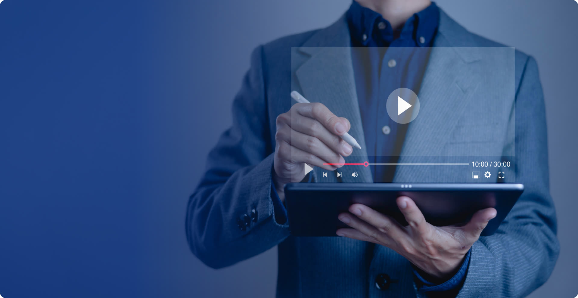 Presenter in a suit annotating a tablet with a stylus behind a floating video-player interface