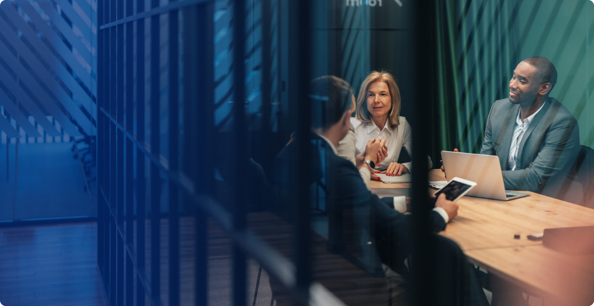 Employer representatives collaborating around a boardroom table