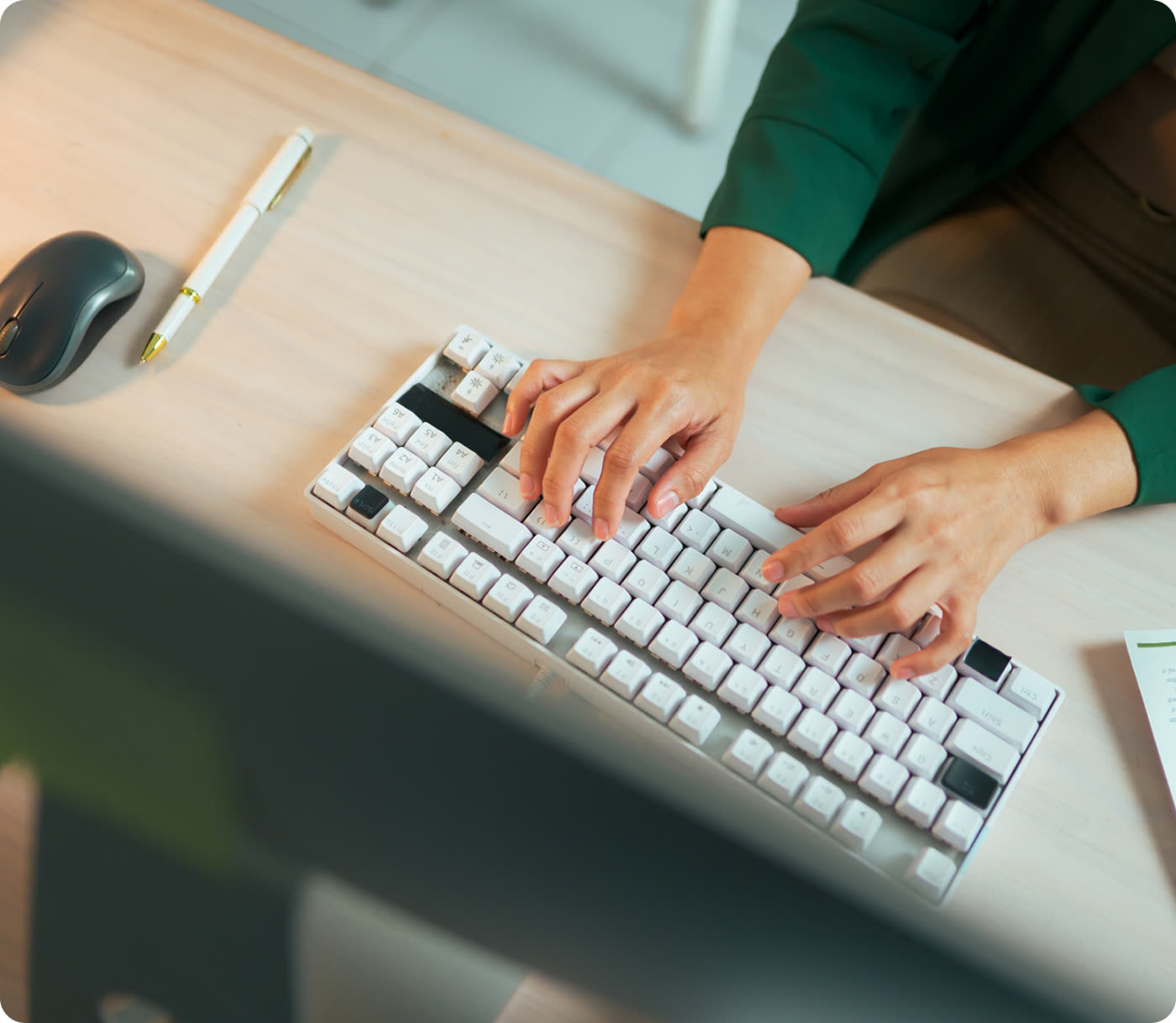 Learner working at a laptop in a softly lit study space